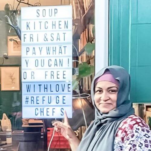 Parliament on King photo of soup kitchen sign and woman