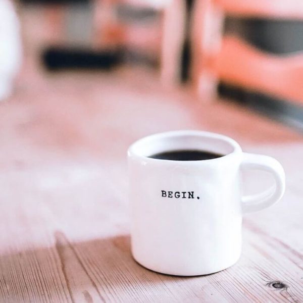 Begin coffee mug represents a new beginning for an organization helping refugees